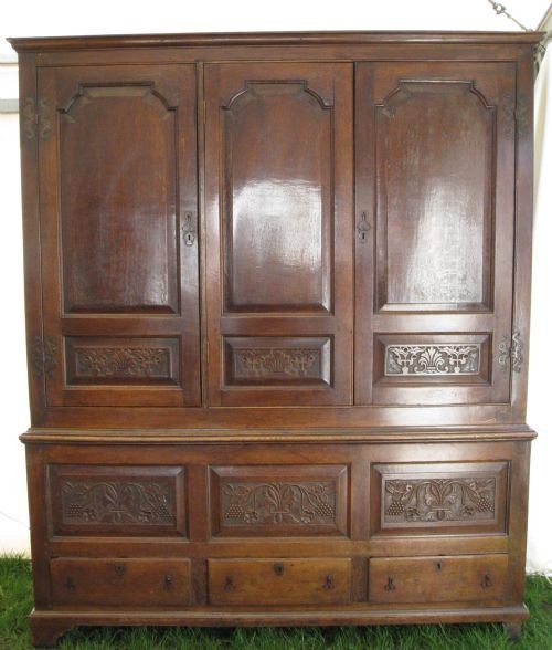 large carved oak livery cupboard