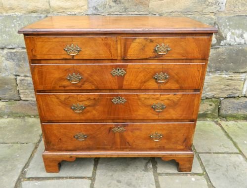 early georgian inlaid walnut chest of drawers