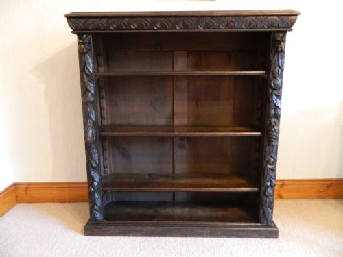 carved oak 'green man' bookcase