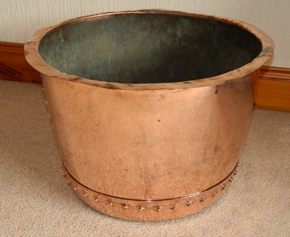 large copper log bin