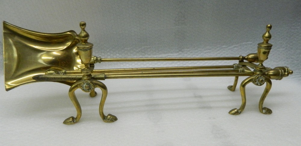 brass andirons with set of fire tools
