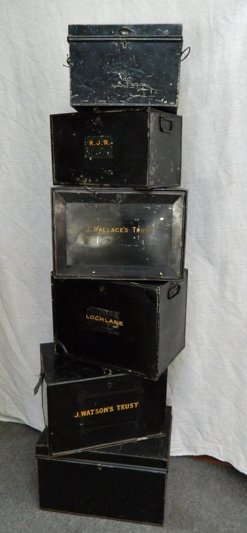 six metal deed boxes