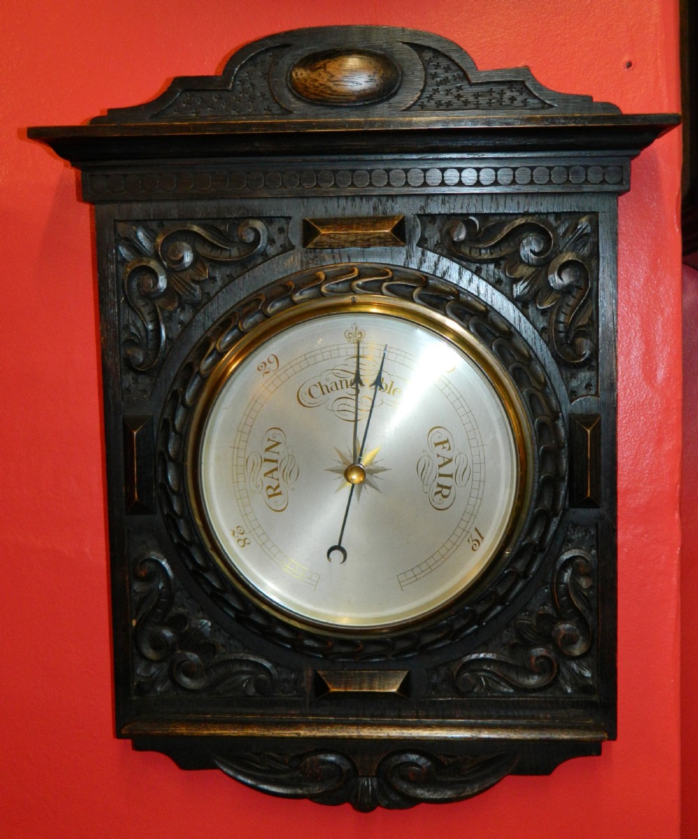 carved oak barometer
